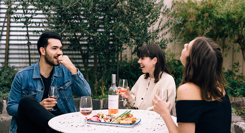 Friends enjoying McPherson wines and food platter